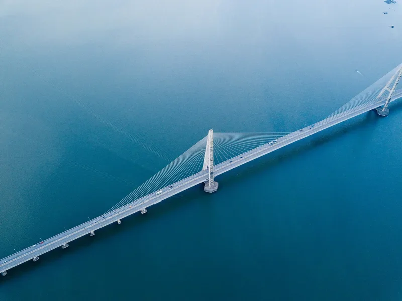 Concrete suspension bridge aerial view, illustrating structural resilience principles